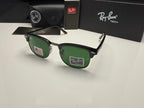 Ray-Ban Clubmaster sunglasses with green lenses and black frames, displayed with their black case, box, and card on a white surface.